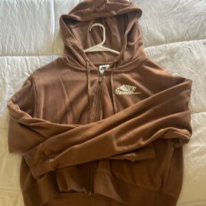 Nike (Size:Small) Light brown cropped hoodie, with cheetah logo.